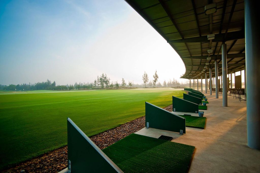 Forest Hill Driving Range — green fairway with practice bays